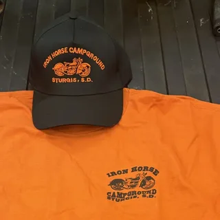 Orange Iron Horse Campground T-shirt and black cap with the motorcycle logo