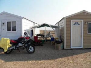 Motorcycle parked between two Iron Horse cabins