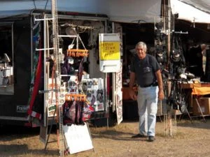 Vendor standing at his booth at Iron Horse Campground